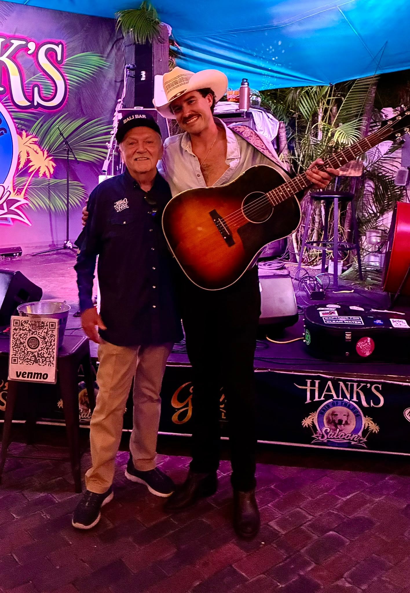 Pierce August posing with a fan after a show at Hank's Hair of the Dog Saloon
